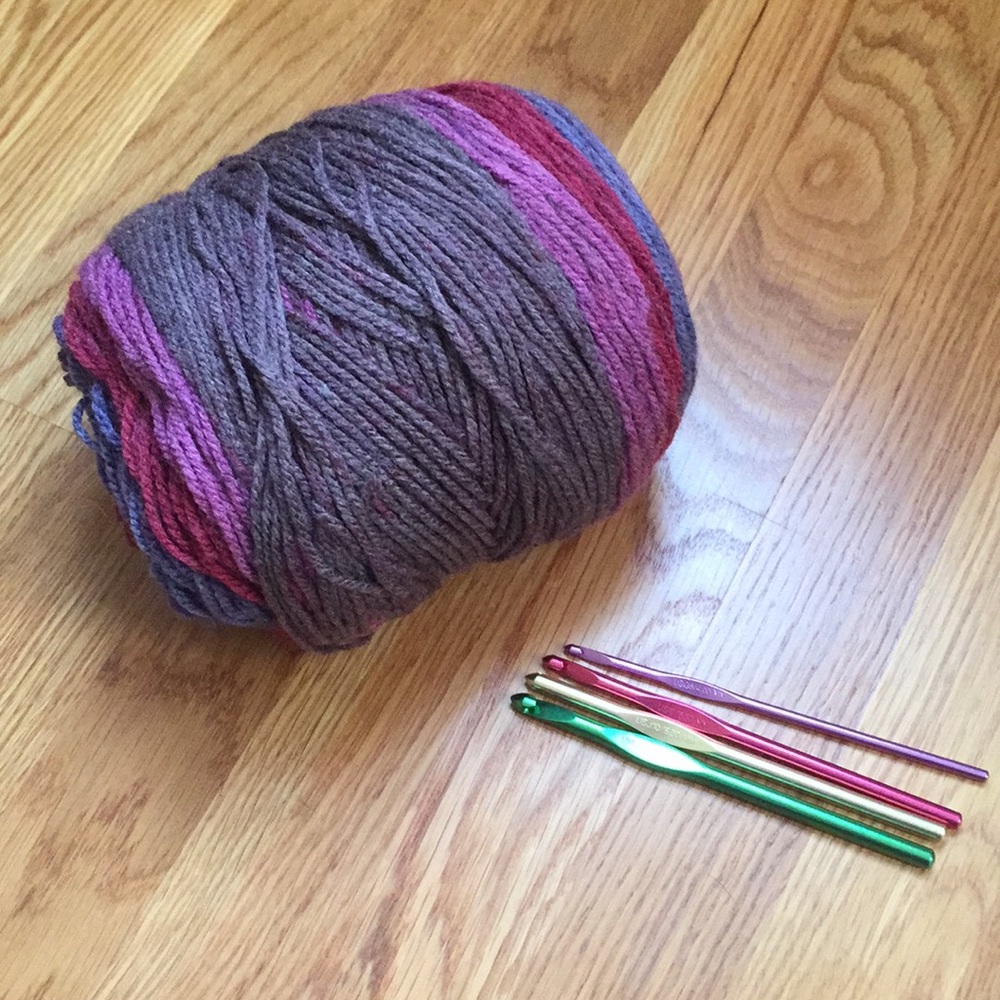Four crochet hooks and yarn. Hooks by Susan Bates.
